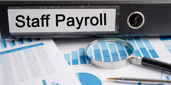 Staff Payroll. Binder data finance report business with graph analysis in office.