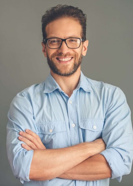 Handsome young businessman in shirt and eyeglasses.
